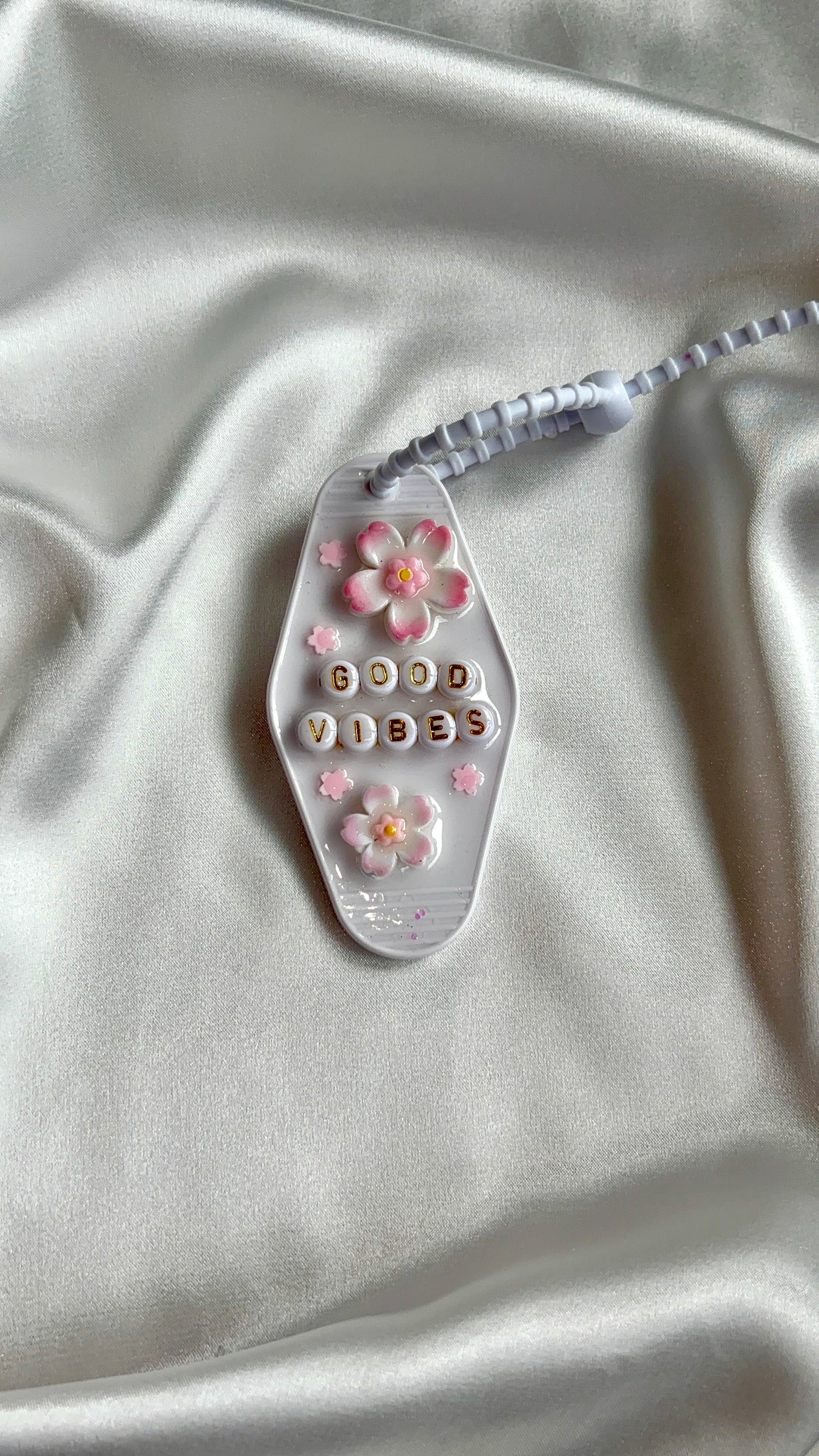 Porte-clés grigri GOOD VIBES