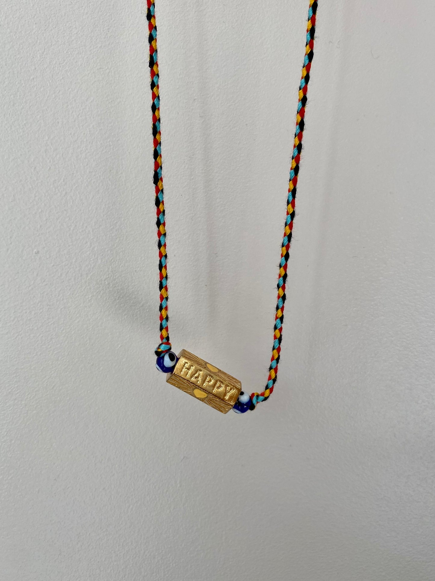 Collier cordon amulette